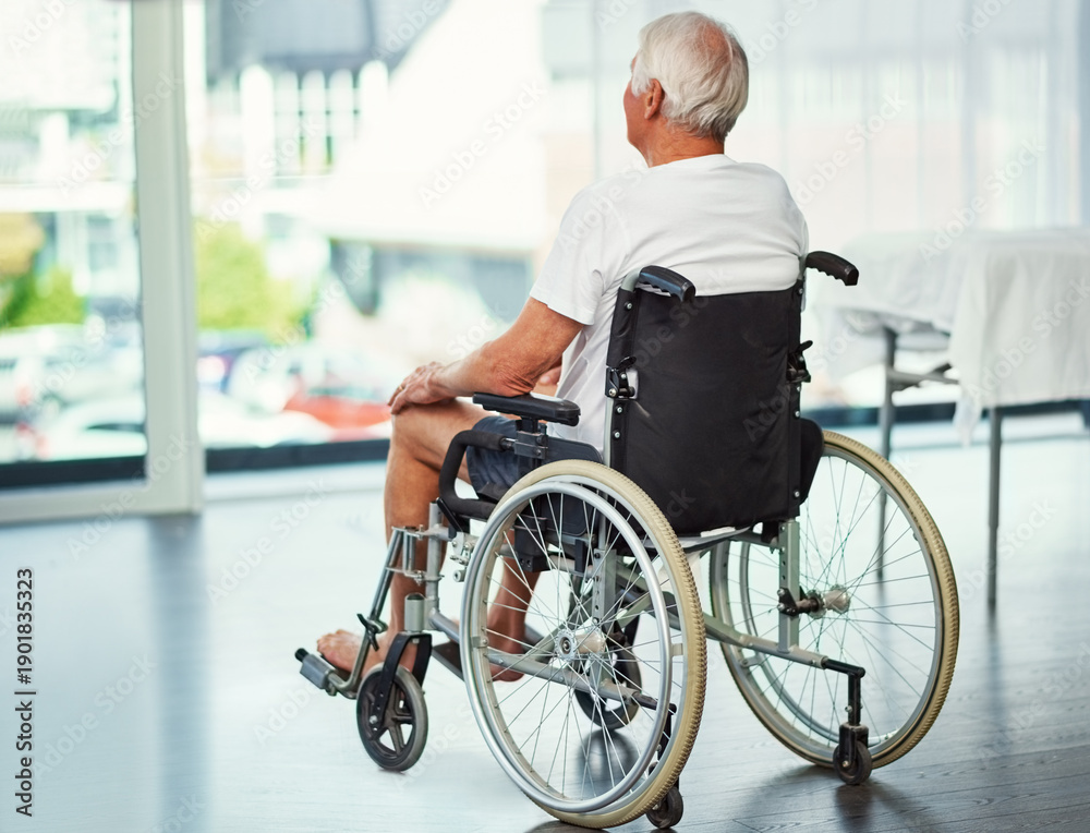 Obraz premium Old man, thinking and back in wheelchair for clinic, reflection and memory or recovery. Elderly person with disability, perspective and rehabilitation with hospital, window and space in retirement