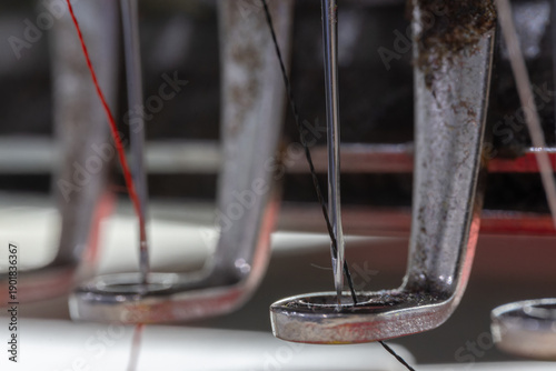 Extreme close-up of Embroidery machine needle in Textile Industry at Garment Manufacturers, Embroidery needle, Needle with thread