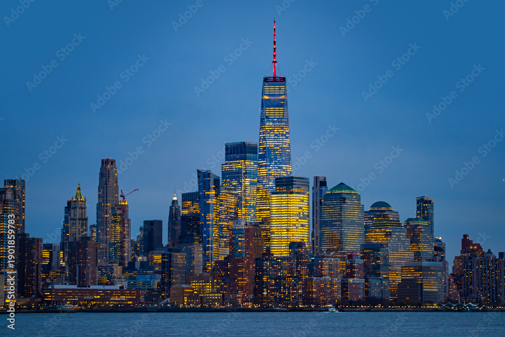 Obraz premium New York City skyline. New York City riverfront at night . New York City night scene. New York City skyscrapers with night lights.