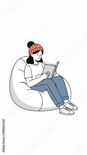 A woman sits on a beanbag chair reading a book