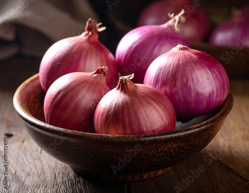 Close-up of vibrant red onions in a rustic wooden bowl