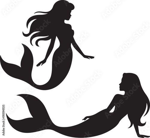 silhouette of two mermaids swimming in water