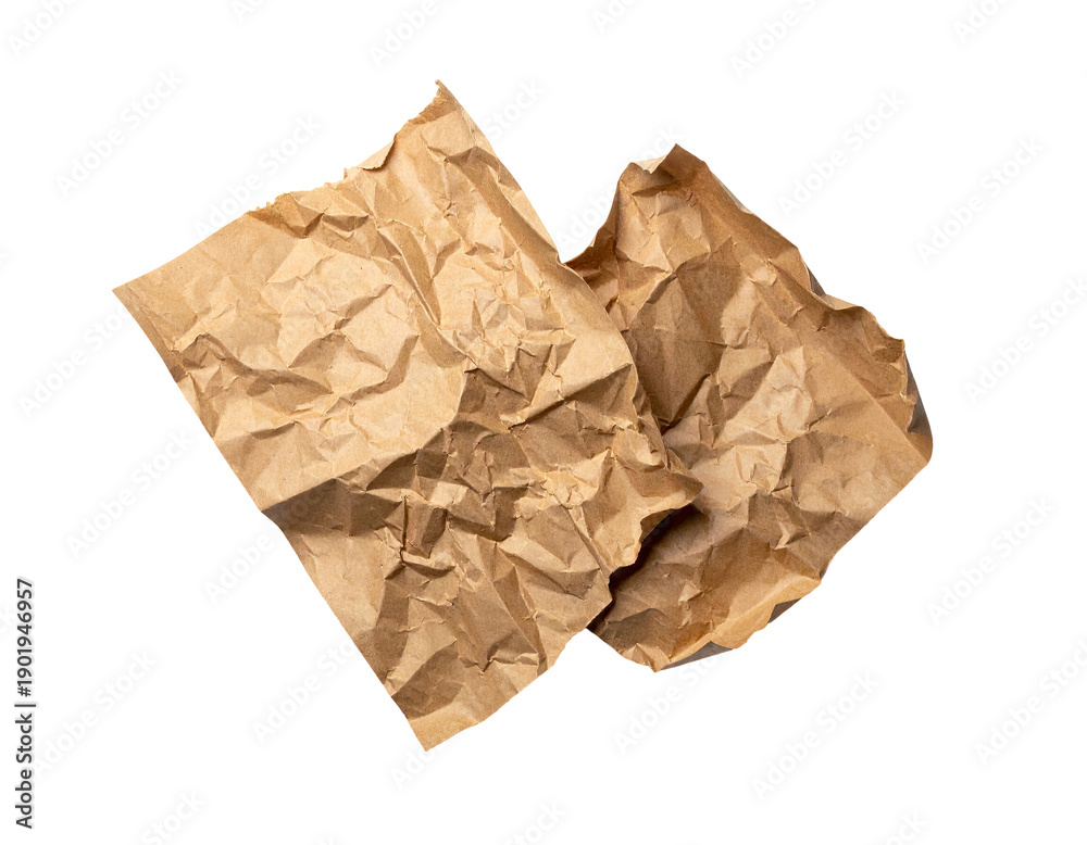 Obraz premium Two pieces of crumpled brown paper on black background