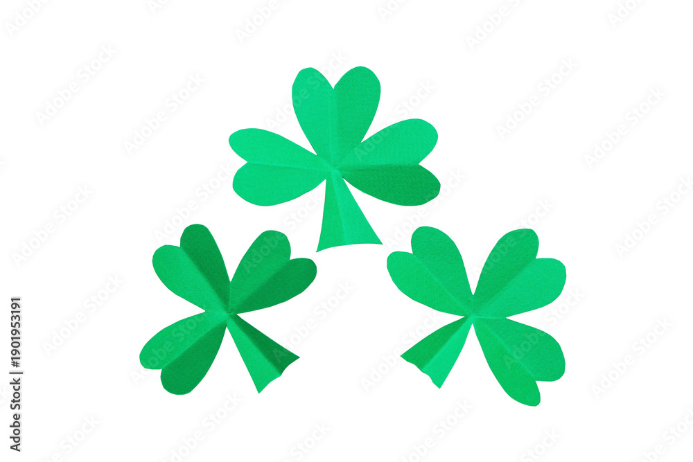 Naklejka premium Three green shamrocks arranged on a white background, isolated, PNG