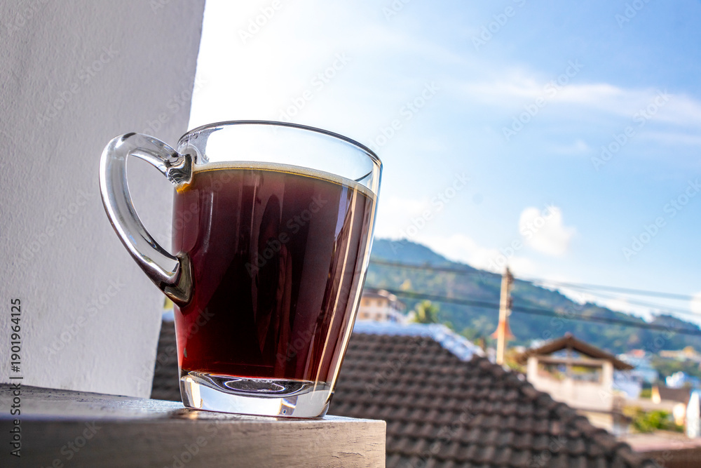 Fototapeta premium Black coffee with tropical landscape terrace balcony panorama view Thailand.