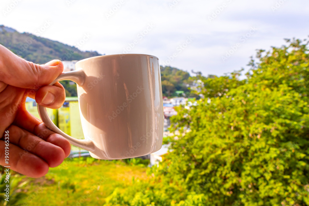 Fototapeta premium Black coffee with tropical landscape terrace balcony panorama view Thailand.