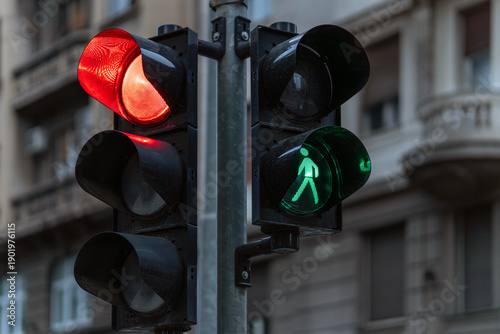Εκτύπωση καμβά Urban traffic signal system with red vehicle light and green pedestrian crossing signal, managing movement at an intersection