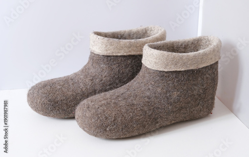 Traditional Russian felt boots on a white background