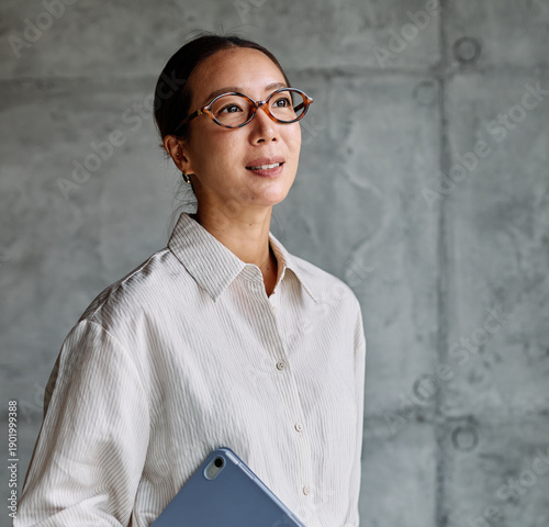 Wallpaper Mural Portrait of a smart young businesswoman, student, teacher or coach holding a tablet Torontodigital.ca