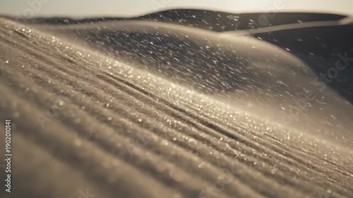 Golden desert dunes shimmering with dew drops at sunrise.