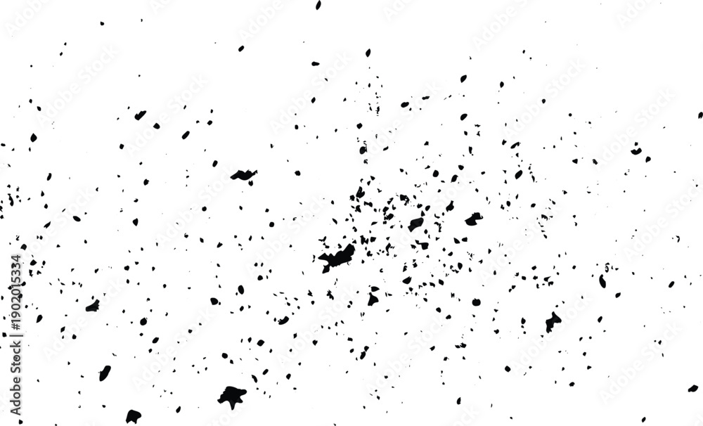 Obraz premium This image shows a scattering of black particles creating a grungy effect on a pristine white surface