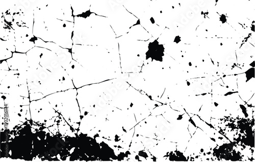 Widespread subtle black crackle texture with scattered grunge splatters spreads across a white background