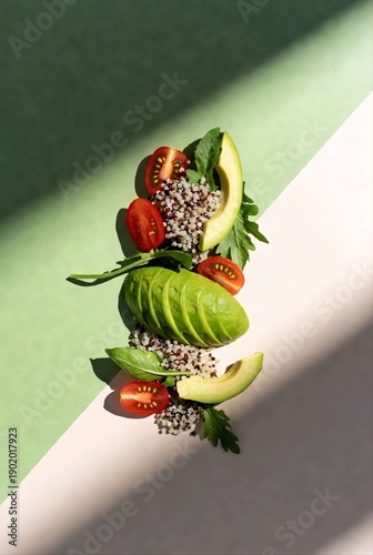 Vertical food art with avocado slices and quinoa salad, healthy organic ingredients illustration on green and cream background, candid minimalist culinary concept