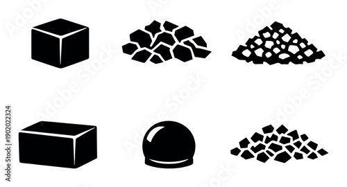 Various shapes of charcoal and coal on dark background