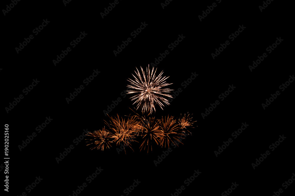 Fototapeta premium Glowing Golden Light Trails and Pyrotechnic Explosion Background