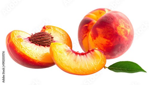Close-up of ripe peaches one whole, one halved showing stone, and a slice with a leaf
