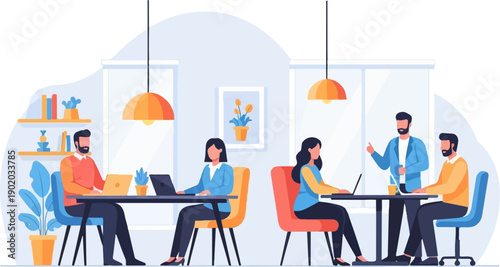 Colleagues collaborate and work on laptops in a modern office setting