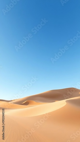 Golden sand dunes stretch endlessly under a vast, cloudless blue sky, capturing the serene and timeless beauty of a remote desert wilderness