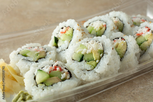 Fotografija A closeup view of a package of California roll.