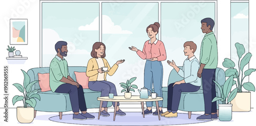 Diverse group of people conversing around a coffee table with refreshments