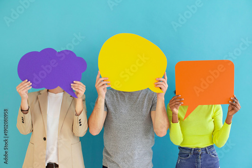 Tableau sur toile Three people holding colorful blank speech bubbles