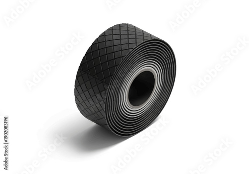 A close-up view of a black tire with a tread pattern, isolated on a plain background, showcasing its texture and design from a tilted angle.