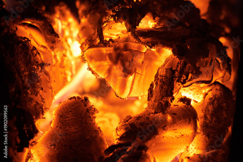Close-up of smoldering wood after burning. Firewood burning in a rural stove.