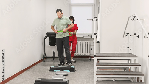 фотографія Elastic resistance band for gait training in physiotherapy