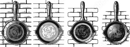 Four vintage cast iron skillets hanging on brick wall, kitchen cookware collection