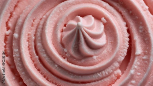 Close up photo of a pink buttercream frosting swirl