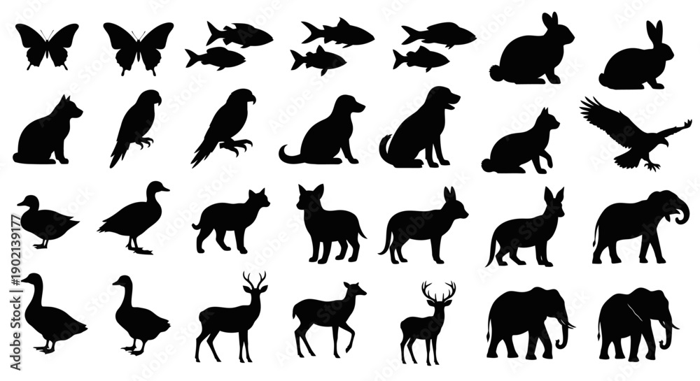 Fototapeta premium A collection of black silhouettes of various animals, including butterflies, fish, rabbits, cats, birds of prey, dogs, ducks, deer, and elephants.