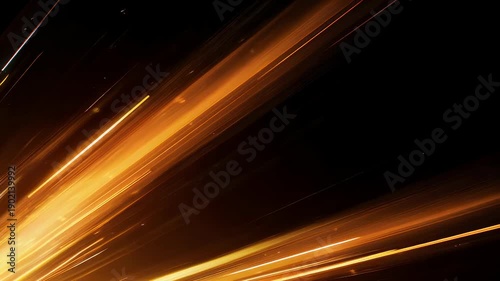 An abstract image features streaks of golden light against a dark background, creating a sense of dynamic motion and energy. The effect is futuristic