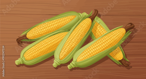 Fresh yellow corn cobs with green husks on a wooden table