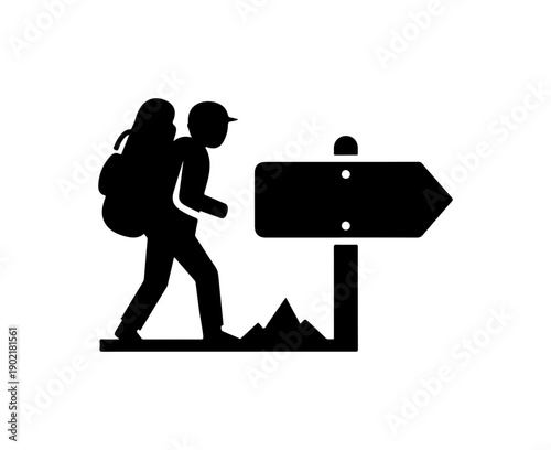 Hikers Following Directional Sign on Trail
