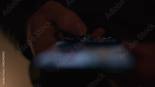 Close up video of a person doom scrolling on social media on a smartphone with content intentionally out of focus, conveying digital addiction technology fatigue and modern screen time behavior for me