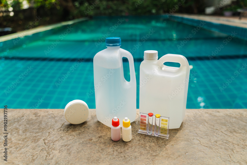 Naklejka premium Pool maintenance chemicals and water testing kit with chlorine tablet and plastic containers on pool edge, clean swimming pool background