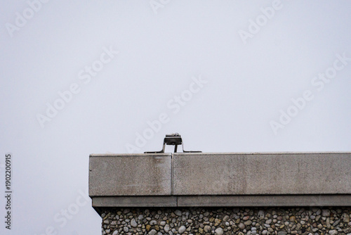Minimalist concrete roof edge against sky