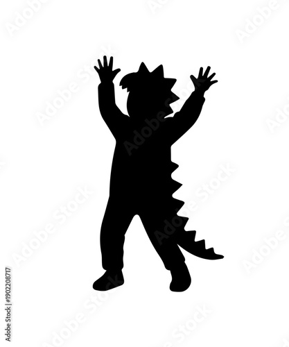 Child in dinosaur costume playing with hands up