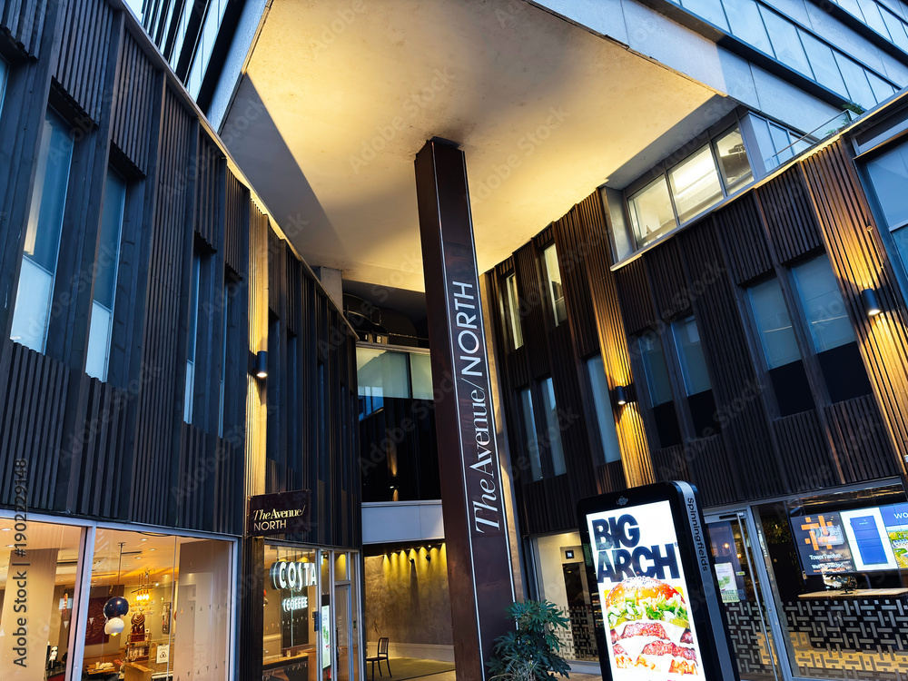 Fototapeta premium Urban shopping center The Avenue North Springfield exterior in Manchester UK with modern architecture and bold signage