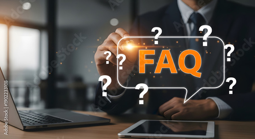 FAQ Conceptualization: A business professional is seen creating a digital representation of a Frequently Asked Questions (FAQ) concept, highlighted by question marks.