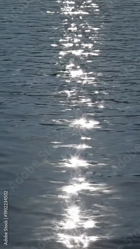 Crystalline Water Shimmer Explore the intricate, sharp-edged patterns of light reflecting on a water surface, giving it a crystalline appearance.