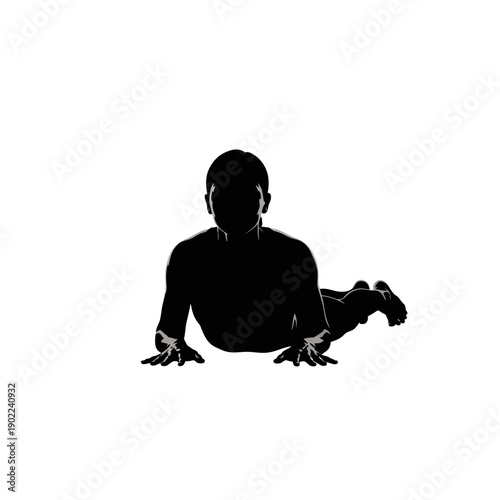 Silhouette of a person practicing yoga in a cobra pose.
