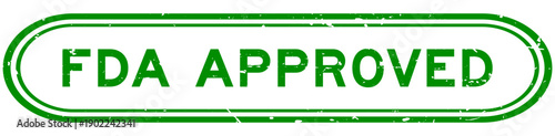 Grunge green FDA approved word rubber seal stamp on white background