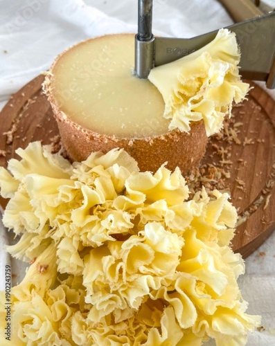 Fotografi Golden cheese rosettes unfurl like culinary blooms, echoing Swiss Cheesemas and