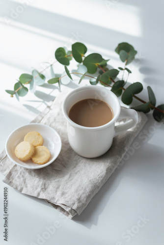 Billede på lærred Vertical Minimal Coffee and Cookies with Eucalyptus in Soft Morning Light