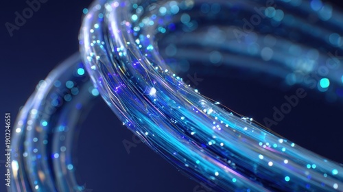 Abstract 3D render of glowing blue and purple fiber optic strands forming a curved loop. The image features bright light particles and a soft bokeh effect against a dark background.