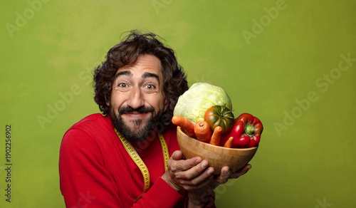 young adult bearded man with vegetables