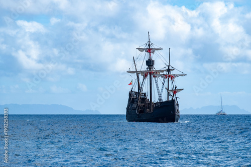 Billede på lærred large black pirate ship sailing on ocean, Jolly Roger flag fantasy adventure sea
