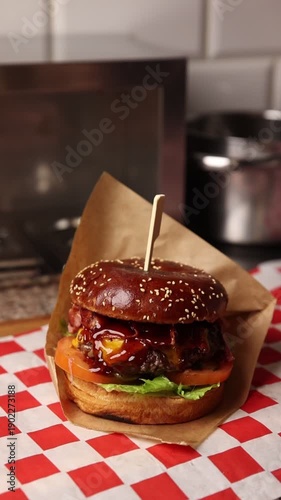The chef makes hamburgers in the kitchen.