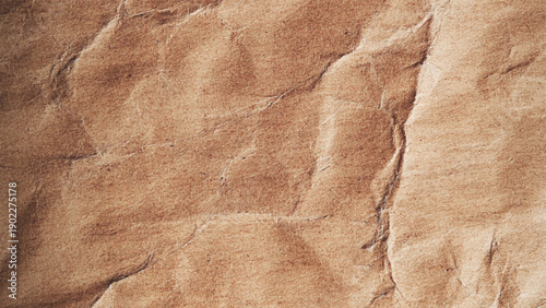 Closeup of brown wrinkled paper. Crumpled and wrinkled brown paper texture background